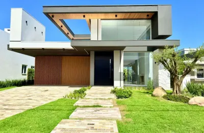 Casa em condomínio fechado com 4 quartos à venda na rua andira, 2009, condomínio dubai resort, capão da canoa, 196 m2 por r$ 1.690.000