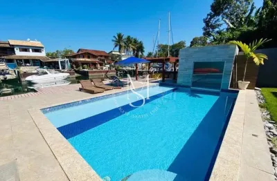 Casa de canal à venda e temporada no porto bracuhy – 5 suítes e sofisticação à beira-mar