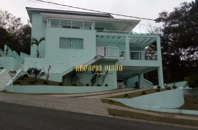 Casa de alto padrão com 4 suítes, cozinha americana e piscina á venda na reserva de ibirapitanga arujá divisa com santa isabel-sp