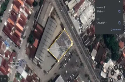 Área escriturada de 1.498,28m de frente para av rio branco, com várias construções, caraguatatuba/sp