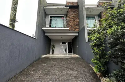 Geminado à venda em joinville sc no bairro saguaçu, semimobiliado, 3 dormitórios com suíte, sala integrada, churrasqueira, garagem para 2 carros