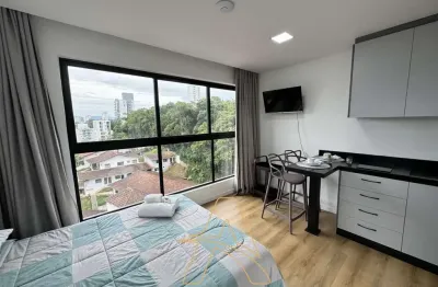 Loft finamente mobiliado com garagem em condomínio completo