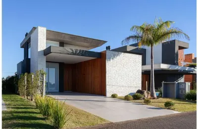 Casa à venda no bairro condomínio reserva das águas - torres/rs