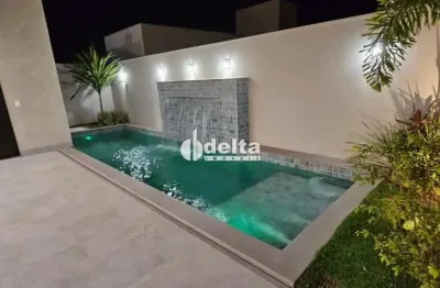 Casa em condomínio com 3 suítes disponível para locação e venda no bairro jardim botânico em uberlândia-mg.