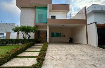 Casa em alto padrão em condomínio fechado localizada lado praia a 300 metros do mar com 3 quartos sendo 1 suíte, Possui área gourmet com churrasqueira,piscina, lavanderia,01 wc externo, móveis planeja