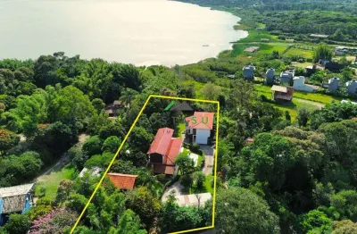 Propriedade exclusiva com vista para a lagoa, 3 residências e piscina em terreno