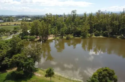 Terreno em condomínio em internacional parque, guaratinguetá/sp