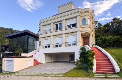 Casa à venda em condomínio em cacupé, 319m² de privativa, 4 suítes e 3 vagas, r$ 4.950.000,00