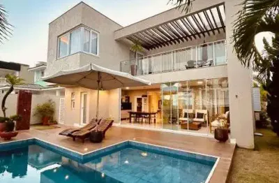Excelente casa com arquitetura moderna com 306 m2 com 4/4 em alphaville l. norte - camaçari