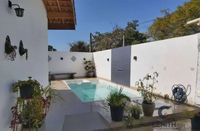 Casa térrea com piscina e 3 dormitórios/suíte e closet à venda, 235 m²