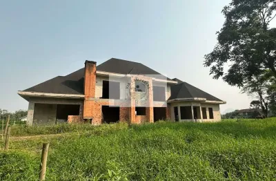 Amplo terreno na estrada da ilha com 139.057 m², plano, cercado, com casas, analisa parcelamento