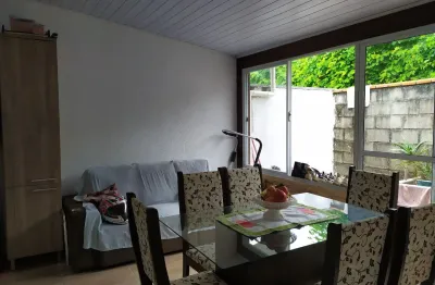 Casa a venda em condomínio fechado de 02 dormitórios com vaga de garagem coberta no bairro bela vista em palhoça-sc