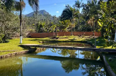 Sítio em canelinha com linda lagoa e totalmente plano aceita permuta