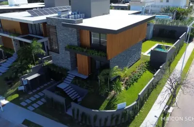 Casa com 4 suítes semimobiliada, condomínio marina philippi, lagoa da conceição, florianópolis/sc.