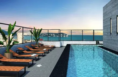 Condominio com lazer de clube e piscina na cobertura. praia da enseada - guarujá