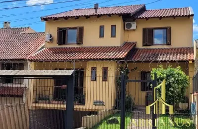 Casa com 3 quartos à venda na rua doutor mário totta, 2812, tristeza, porto alegre por r$ 870.000