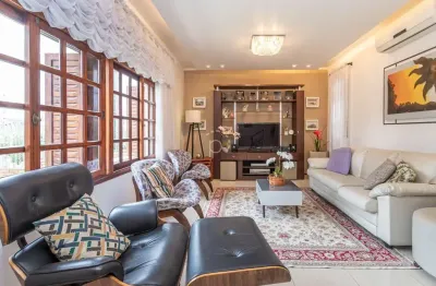 Casa com 4 quartos à venda na rua esteio, 220, cavalhada, porto alegre por r$ 810.000