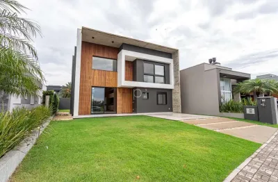 Casa em condomínio fechado com 4 quartos à venda na divida, 750, centro, xangri-lá por r$ 2.180.000