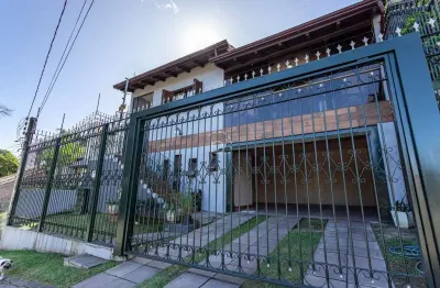 Casa com 3 quartos à venda na rua doutor egydio michaelsen, 250, cavalhada, porto alegre por r$ 950.000