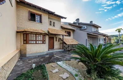 Casa com 4 quartos à venda na rua lloyd de andrade polidoro, 60, ipanema, porto alegre por r$ 1.250.000