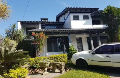 Casa com 4 quartos à venda na rua doutor mário totta, 2087, tristeza, porto alegre por r$ 1.680.000