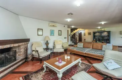 Casa em condomínio fechado com 5 quartos à venda na Avenida Juca Batista, 8000, Belém Novo, Porto Alegre por R$ 1.980.000