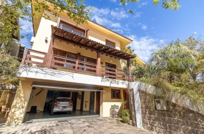 Casa em condomínio fechado com 3 quartos à venda na rua adriano pereira da silva, 311, vila nova, porto alegre por r$ 1.250.000