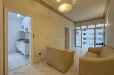 Apartamento com varanda e vista livre a uma quadra da praia das pitangueiras de 2 quartos com 1 vag