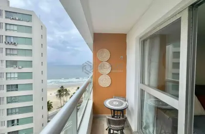 Apartamento com varanda e vista mar na beira mar da praia das pitangueiras, guaruja