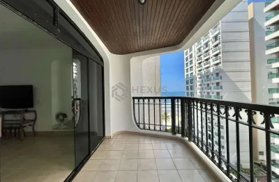 Apartamento com varanda e vista mar na beira mar da praia das pitangueiras, guaruja