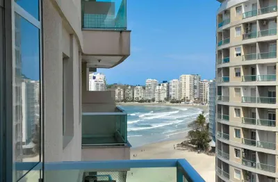 Apartamento com varanda e vista mar na quadra mar da praia das pitangueiras, guaruja
