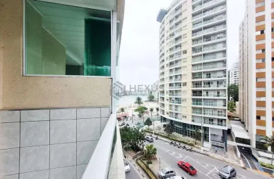Apartamento com varanda e vista mar na quadra mar da praia das pitangueiras, guaruja