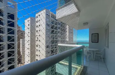 Apartamento com varanda e vista mar na quadra mar da praia das pitangueiras, guaruja