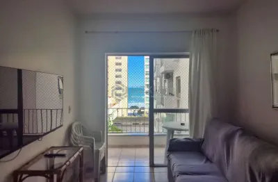 Apartamento com varanda e vista mar na beira mar da praia das pitangueiras, guaruja