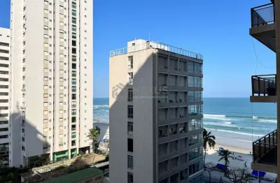 Apartamento com varanda e vista mar na beira mar da praia das pitangueiras, guaruja