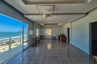 Apartamento frente mar reformado com varanda e lazer na praia das pitangueiras, guaruja