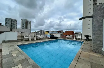 Apartamento com varanda e lazer na praia da enseada, guaruja