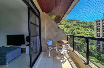 Apartamento com varanda e lazer na praia das pitangueiras, guaruja