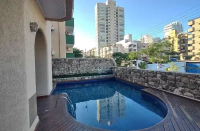 Apartamento com varanda e lazer na praia da enseada, guaruja
