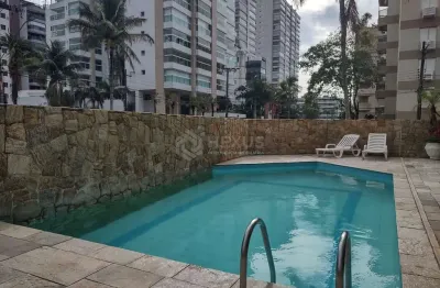 Apartamento com varanda e lazer na praia da enseada, guaruja