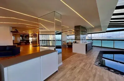 Apartamento reformado frente mar com piscina na varanda na praia das asturias, guaruja