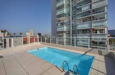 Apartamento com varanda e lazer na praia da enseada, guaruja