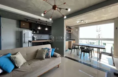Apartamento com varanda gourmet e lazer em prédio novo na Praia das Pitangueiras, Guaruja