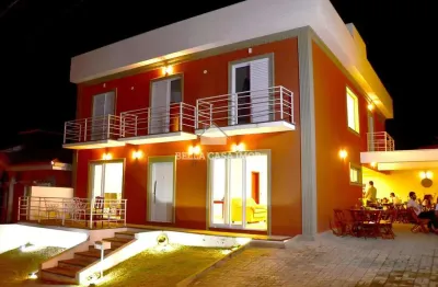 Casa ampla em condomínio fechado – 5 quartos, espaço gourmet e área de lazer completa