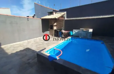 Casa térrea com piscina aquecida a 500m da praia – 3 dormitórios