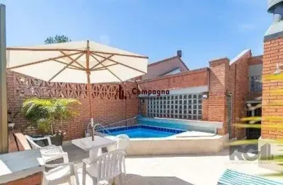 Casa em condomínio fechado com 3 quartos à venda na Avenida Jacuí, 978, Cristal, Porto Alegre