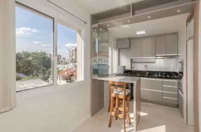 Apartamento à venda no bairro menino deus com 1 dormitório, vaga e elevador: compacto e elegante!