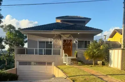 Linda casa com 3 suítes de frente para área de conservação no condomínio aruã em mogi das cruzes sp.