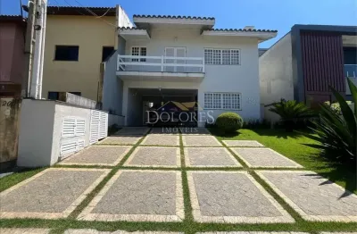 Bela casa com fundo para reserva com 3 dorm. sendo 1 suíte no condomínio aruã em mogi das cruzes.