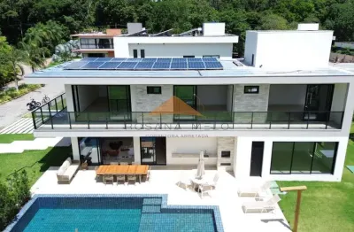 Belíssima casa em aldeias com 370m², 4 suítes, piscina privativa, espaço gourmet com churrasqueira e lavabo, 4 vagas de garagem